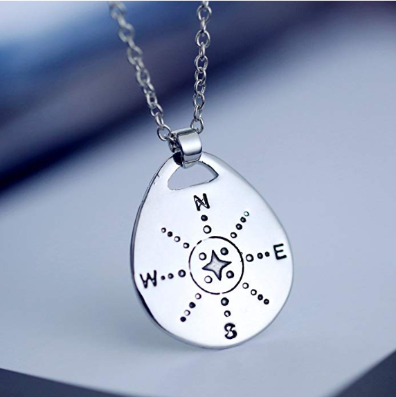 Stainless steel compass necklace pendant on chain symbolizing direction and adventure