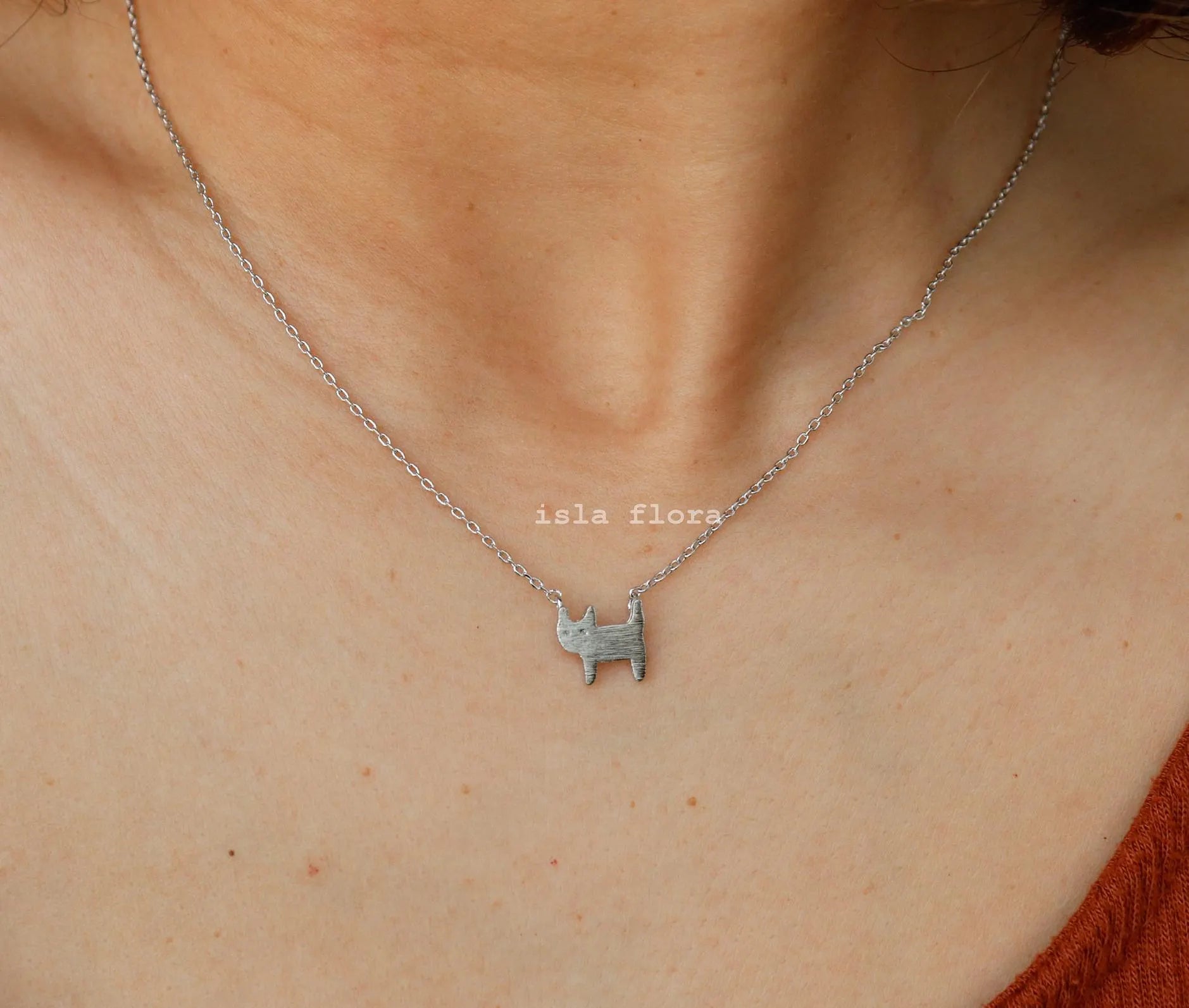 Minimalist cat necklace for women with brushed gold pendant and delicate feline outline